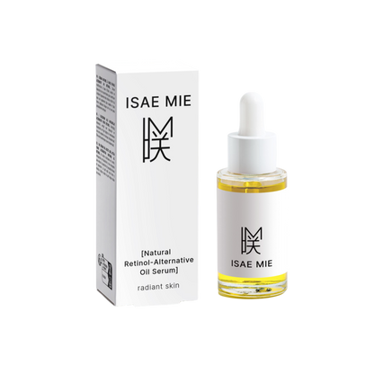 Dropper dispensing Isae Mie's Natural Retinol Alternative Oil Serum showcasing its silky texture.